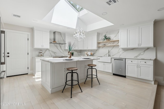 8 Olden Ct, Colts Neck, NJ 07722 - kitchen with wall chimney exhaust hood, dishwasher, open shelves, a skylight, and tasteful backsplash