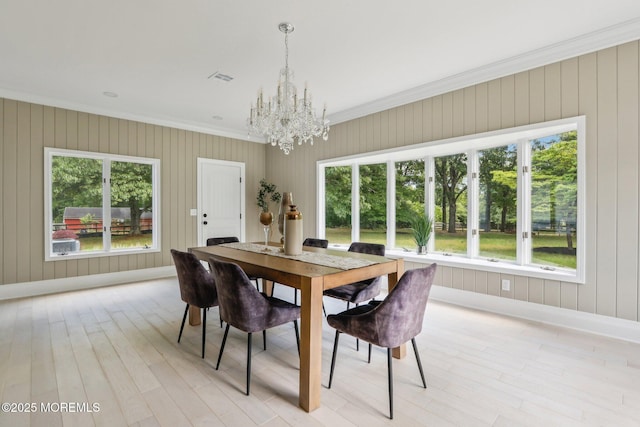8 Olden Ct, Colts Neck, NJ 07722 - dining space featuring a chandelier, ornamental molding, and light wood-type flooring