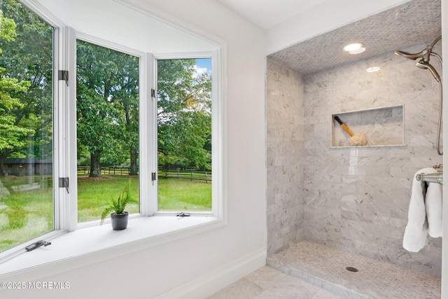 8 Olden Ct, Colts Neck, NJ 07722 - full bath with a tile shower, plenty of natural light, marble finish floors, and view of scattered trees