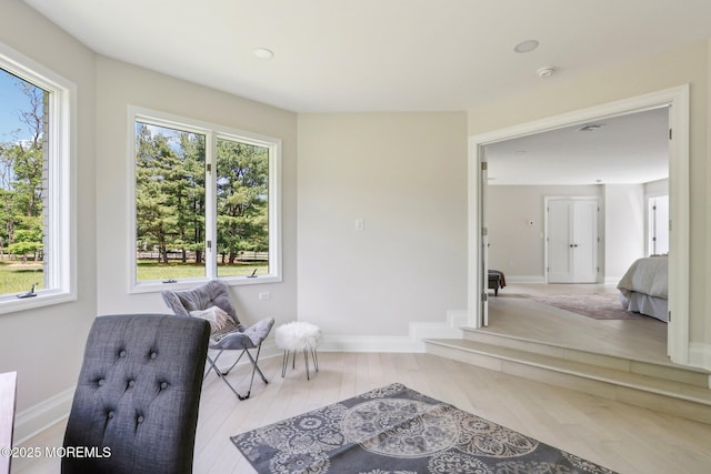 8 Olden Ct, Colts Neck, NJ 07722 - sitting room with plenty of natural light and wood finished floors