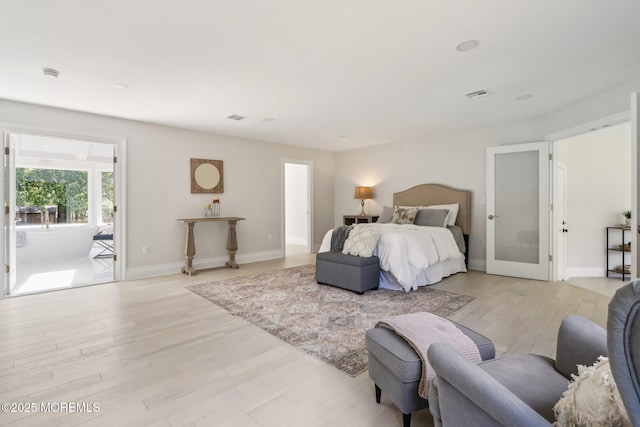 8 Olden Ct, Colts Neck, NJ 07722 - bedroom featuring light wood-style flooring and french doors