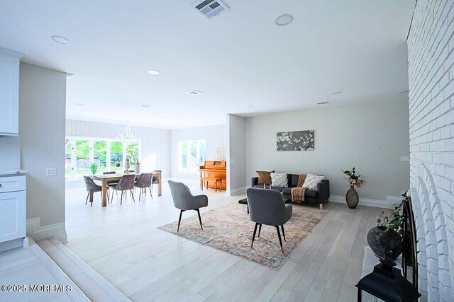 8 Olden Ct, Colts Neck, NJ 07722 - living room featuring a chandelier, light wood-type flooring, a fireplace, and recessed lighting