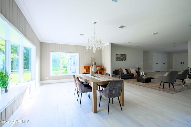 8 Olden Ct, Colts Neck, NJ 07722 - dining room featuring ornamental molding, light wood-style floors, and a chandelier