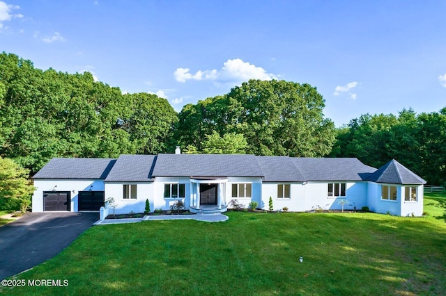 8 Olden Ct, Colts Neck, NJ 07722 - ranch-style house featuring an attached garage, asphalt driveway, and a front yard