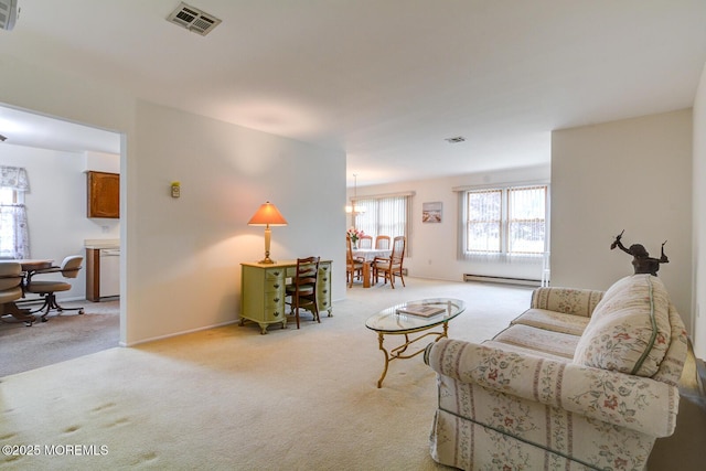2 Thames Pl, Brick, NJ 08723 - living room featuring light carpet, baseboard heating, and a chandelier
