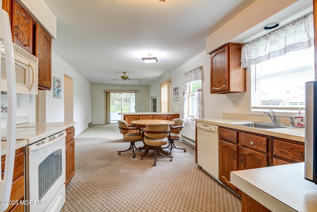 2 Thames Pl, Brick, NJ 08723 - kitchen with white appliances, a sink, light colored carpet, and brown cabinetry