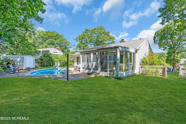 162 Delaware Ave, Atlantic Highlands, NJ 07716 - back of property with a sunroom, a patio area, a lawn, and a chimney