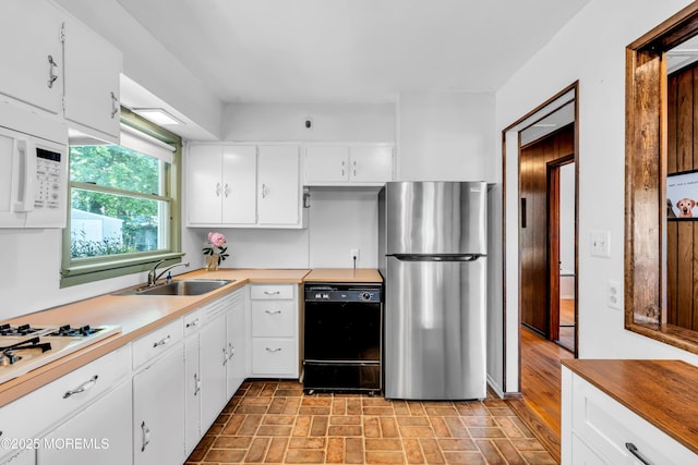 162 Delaware Ave, Atlantic Highlands, NJ 07716 - kitchen featuring white appliances, a sink, white cabinets, and brick patterned floors