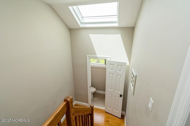 580 Patten Ave # 53, Long Branch, NJ 07740 - stairs featuring a skylight, wood finished floors, and baseboards