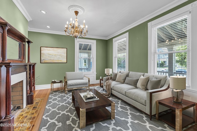 511 4th Ave, Asbury Park, NJ 07712 - living room with baseboards, a chandelier, wood finished floors, a fireplace with flush hearth, and crown molding