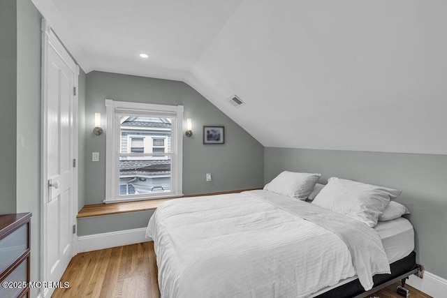 511 4th Ave, Asbury Park, NJ 07712 - bedroom featuring vaulted ceiling, wood finished floors, and baseboards