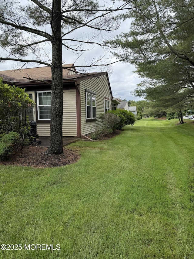 145A Concordia Cir, Monroe, NJ 08831 - view of side of home with a yard