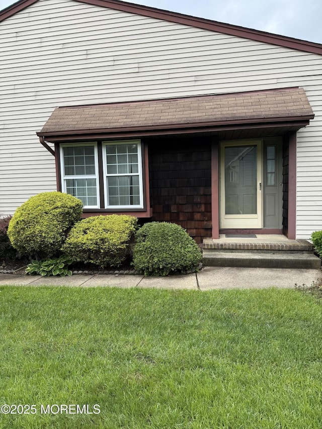 145A Concordia Cir, Monroe, NJ 08831 - property entrance featuring a lawn and roof with shingles