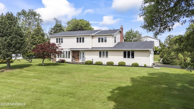 27 Sargent Rd, Freehold, NJ 07728 - traditional-style house with a chimney and a front yard
