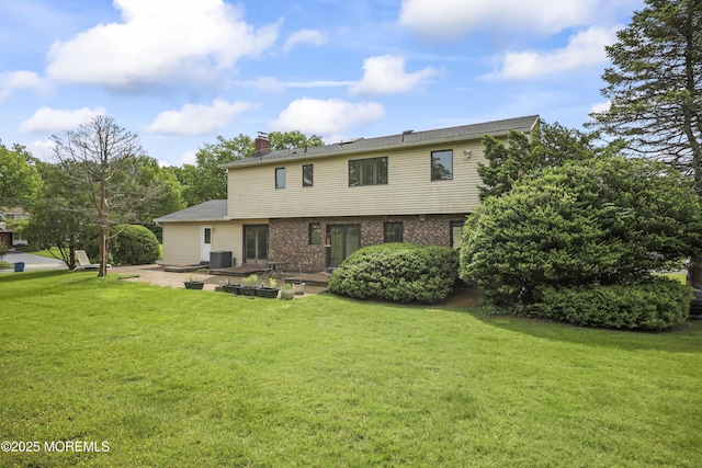 27 Sargent Rd, Freehold, NJ 07728 - view of front facade featuring a front yard, a chimney, brick siding, and a patio