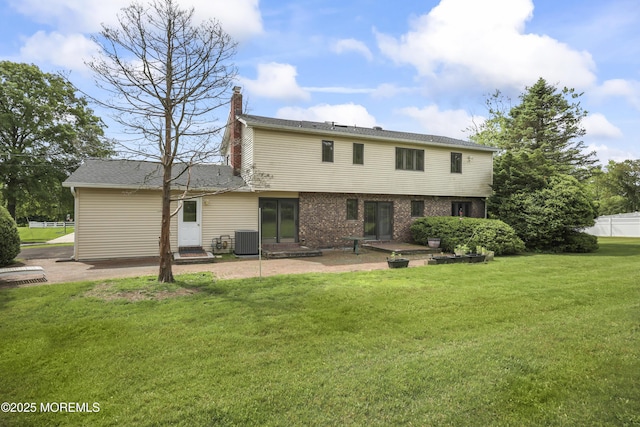 27 Sargent Rd, Freehold, NJ 07728 - back of property featuring cooling unit, a chimney, and a patio area