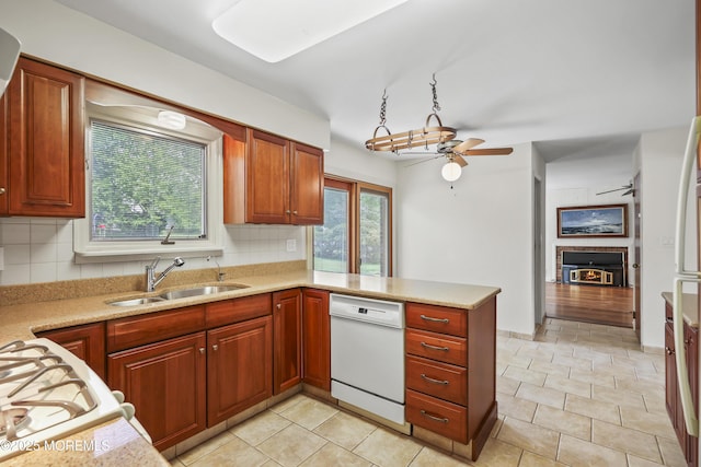 27 Sargent Rd, Freehold, NJ 07728 - kitchen featuring dishwasher, a sink, a ceiling fan, and tasteful backsplash