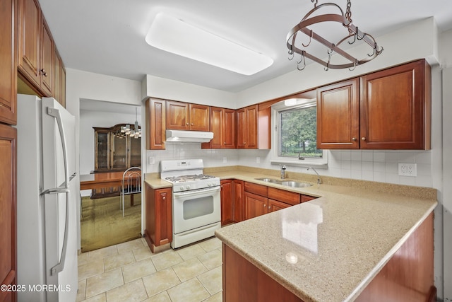 27 Sargent Rd, Freehold, NJ 07728 - kitchen with white appliances, a chandelier, a sink, and under cabinet range hood