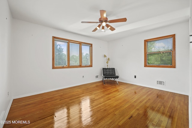 27 Sargent Rd, Freehold, NJ 07728 - unfurnished room with plenty of natural light, light wood-style flooring, a ceiling fan, and baseboards