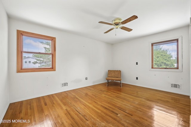 27 Sargent Rd, Freehold, NJ 07728 - spare room with light wood-type flooring, a ceiling fan, and baseboards