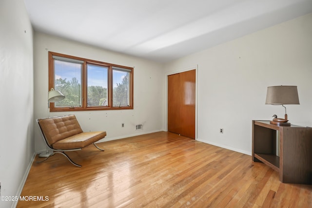27 Sargent Rd, Freehold, NJ 07728 - sitting room with light wood-style flooring and baseboards