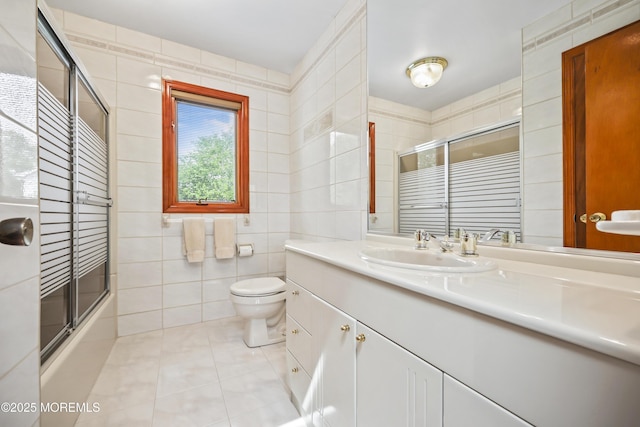 27 Sargent Rd, Freehold, NJ 07728 - bathroom featuring tile walls, tile patterned flooring, vanity, toilet, and enclosed tub / shower combo