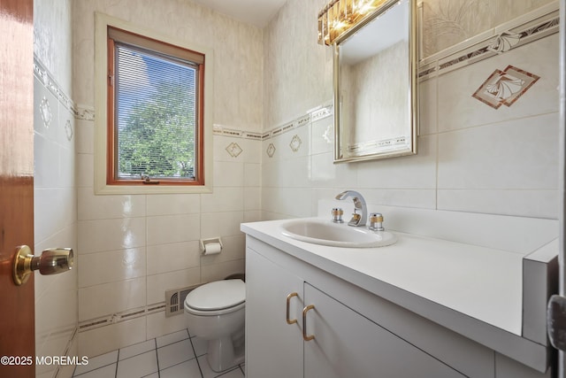 27 Sargent Rd, Freehold, NJ 07728 - half bathroom featuring tile walls, vanity, toilet, and tile patterned floors