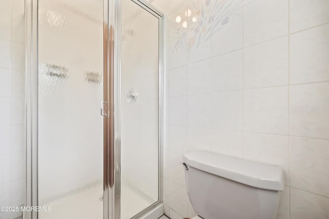 27 Sargent Rd, Freehold, NJ 07728 - bathroom featuring tile walls, a stall shower, and toilet