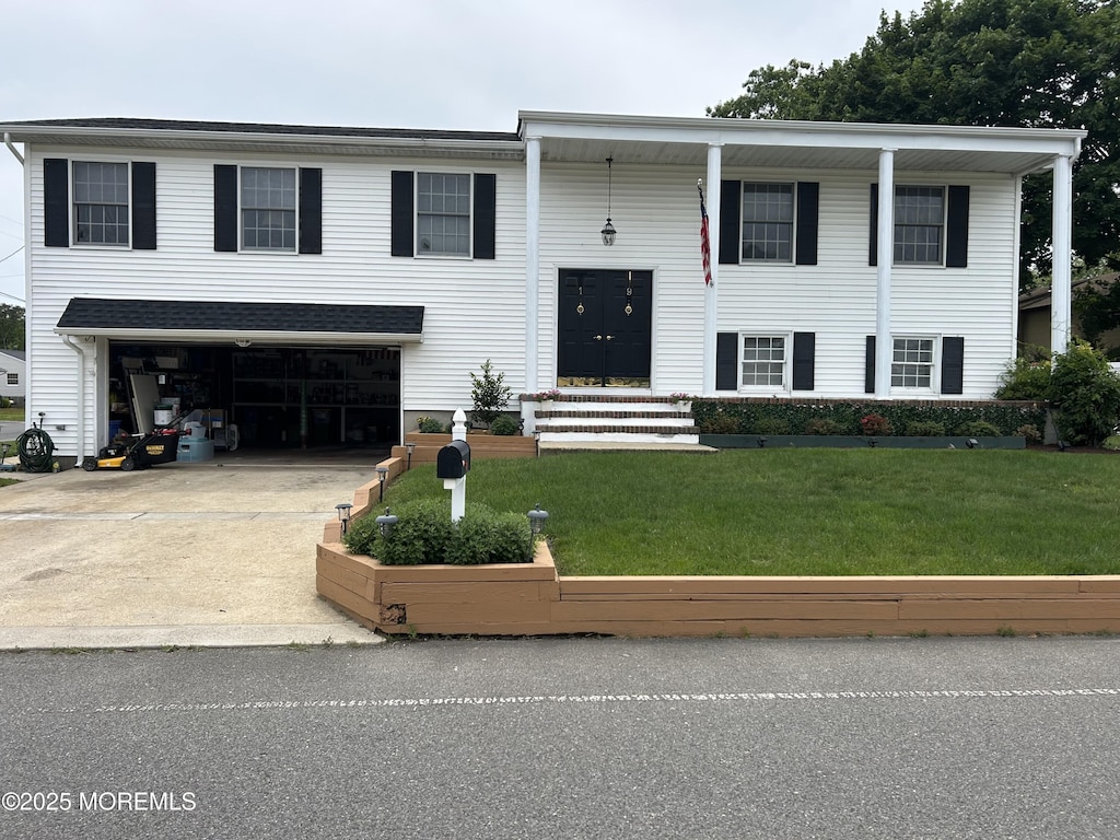 19 Elm St, Beachwood, NJ 08722 - split foyer home with an attached garage, a front lawn, and driveway