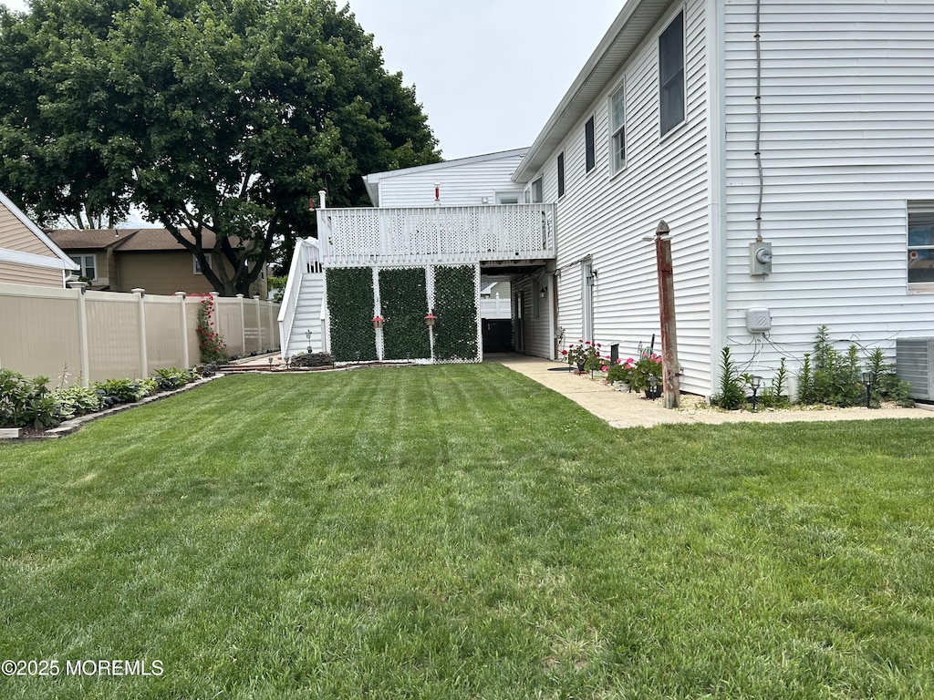 19 Elm St, Beachwood, NJ 08722 - view of yard with stairs, a deck, and central AC