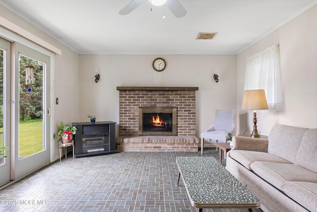 24 Heidl Ave, West Long Branch, NJ 07764 - living area with plenty of natural light, crown molding, a fireplace, a ceiling fan, and brick patterned floors