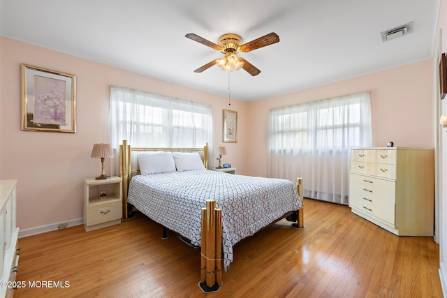 24 Heidl Ave, West Long Branch, NJ 07764 - bedroom featuring multiple windows, light wood finished floors, and baseboards
