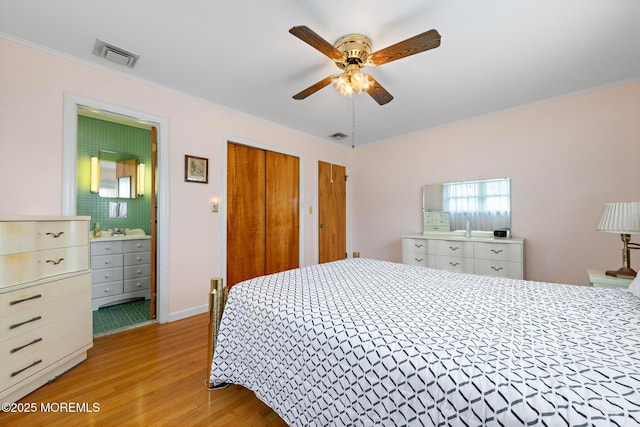 24 Heidl Ave, West Long Branch, NJ 07764 - bedroom with light wood-type flooring, multiple closets, ornamental molding, connected bathroom, and ceiling fan