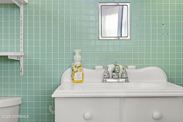 24 Heidl Ave, West Long Branch, NJ 07764 - bathroom with vanity, tile walls, and toilet