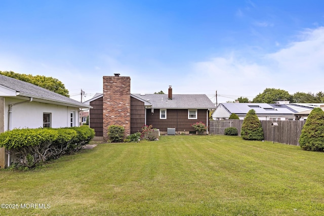 24 Heidl Ave, West Long Branch, NJ 07764 - rear view of property featuring a chimney