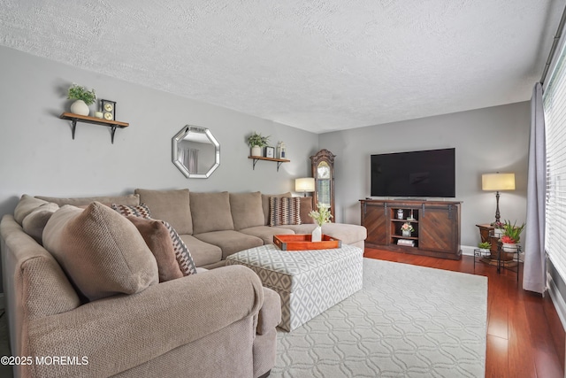 70 Walnut Ave, Red Bank, NJ 07701 - living area featuring wood finished floors, a textured ceiling, and baseboards