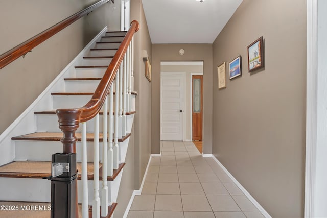 70 Walnut Ave, Red Bank, NJ 07701 - hall with tile patterned flooring, stairway, and baseboards