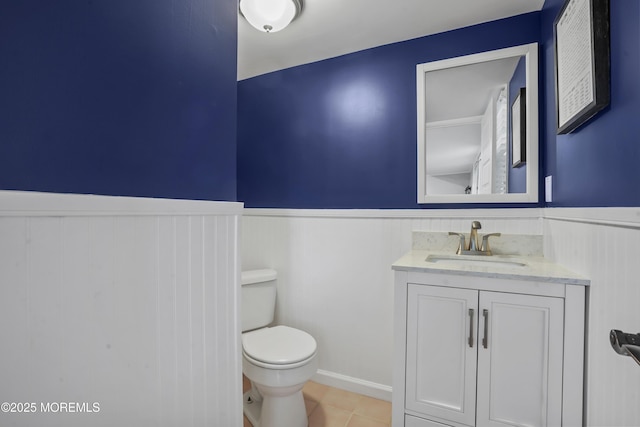 70 Walnut Ave, Red Bank, NJ 07701 - bathroom with a wainscoted wall, toilet, vanity, and tile patterned flooring
