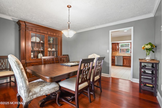 70 Walnut Ave, Red Bank, NJ 07701 - dining room featuring wood finished floors, a textured ceiling, and crown molding