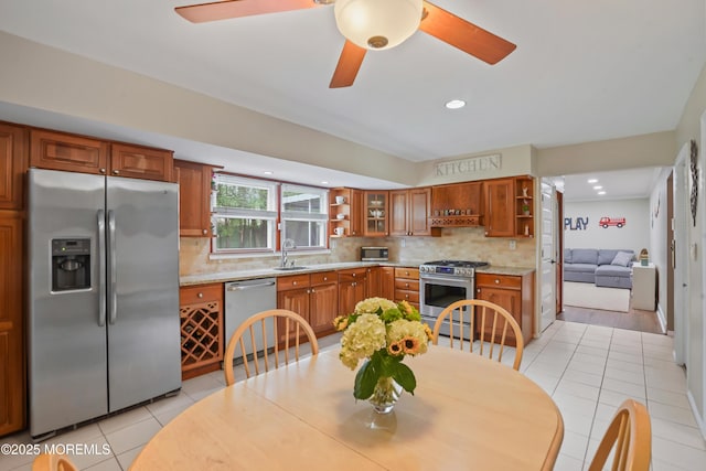 70 Walnut Ave, Red Bank, NJ 07701 - kitchen with stainless steel appliances, open shelves, a sink, light tile patterned floors, and recessed lighting