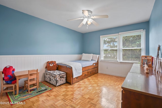 70 Walnut Ave, Red Bank, NJ 07701 - bedroom with a wainscoted wall, baseboards, and a ceiling fan