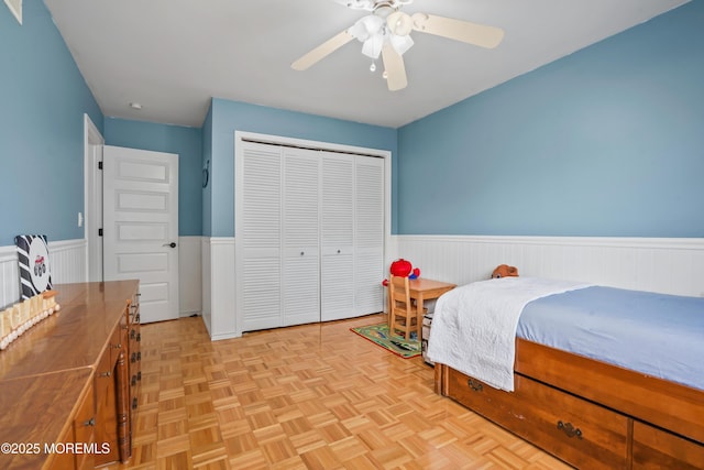 70 Walnut Ave, Red Bank, NJ 07701 - bedroom with wainscoting, a closet, and ceiling fan