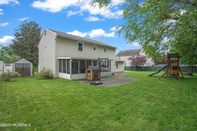 70 Walnut Ave, Red Bank, NJ 07701 - rear view of property with a sunroom, a patio, and a playground