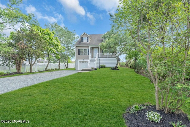 27 Main St, Port Monmouth, NJ 07758 - view of front facade featuring gravel driveway, a garage, and stairs