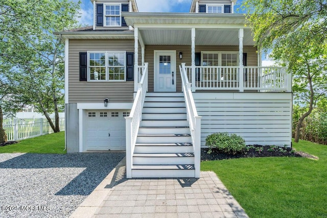 27 Main St, Port Monmouth, NJ 07758 - view of front of home featuring an attached garage, driveway, stairs, and a porch