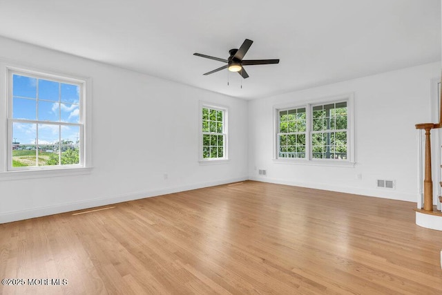 27 Main St, Port Monmouth, NJ 07758 - unfurnished room featuring plenty of natural light, light wood finished floors, ceiling fan, and baseboards