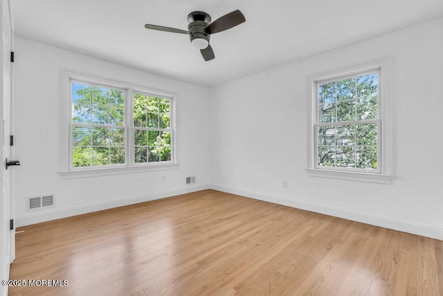 27 Main St, Port Monmouth, NJ 07758 - unfurnished room with plenty of natural light, a ceiling fan, and baseboards