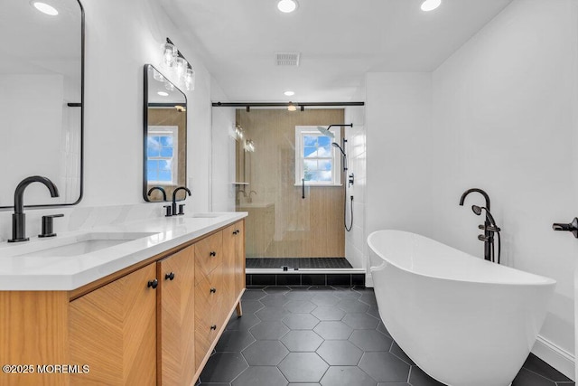27 Main St, Port Monmouth, NJ 07758 - full bathroom with a stall shower, a freestanding tub, double vanity, recessed lighting, and tile patterned flooring