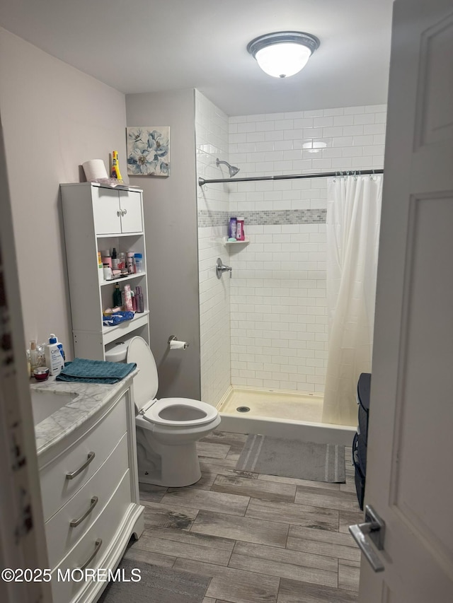 279 Washington St, Keyport, NJ 07735 - bathroom featuring toilet, a shower stall, vanity, and wood finished floors