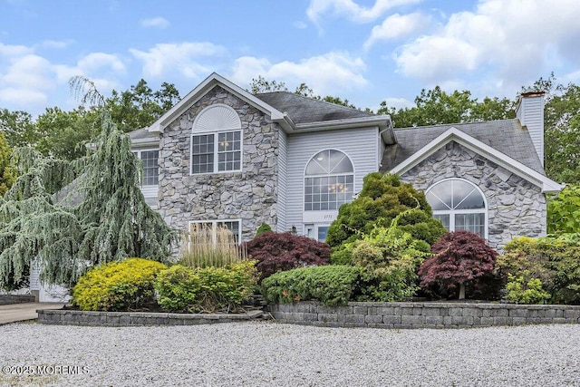 1771 Calico Ln, Toms River, NJ 08753 - view of front of house featuring stone siding and a chimney